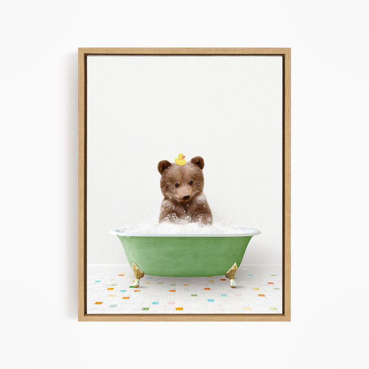 A cute brown bear sitting in a green bathtub filled with bubbles, with a yellow rubber duck perched on its head.