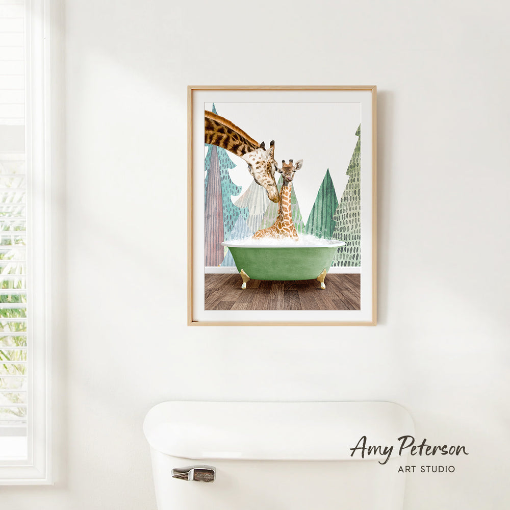 A framed painting of two giraffes in a bathtub, surrounded by a forest scene, hangs on a white wall.