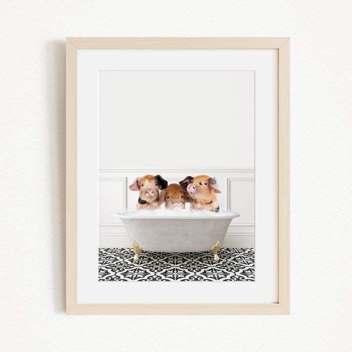 Three adorable pigs sitting in a white bathtub filled with bubbles, creating a playful and whimsical scene.