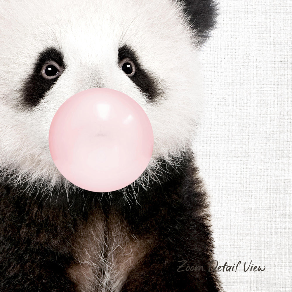 A panda bear blowing a bubble with a pink bubble gum bubble.