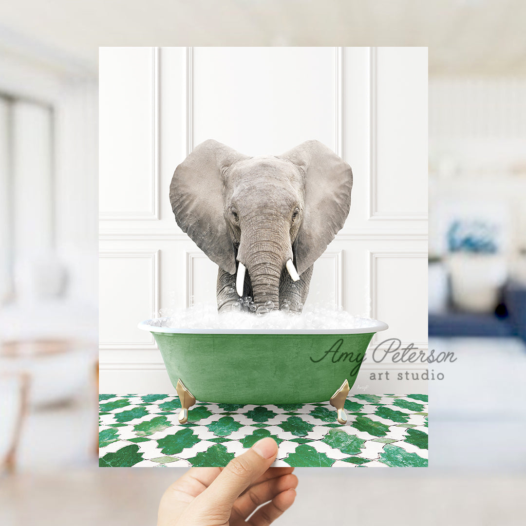 a hand holding a card with an elephant in a bathtub