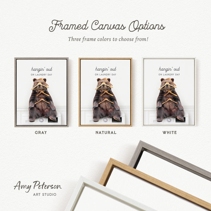 three framed canvas options, each with a different color: gray, natural, and white. The text above the images reads " Framed Canvas Options" and "Three frame colors to choose from!". The text below the images reads "hangin' out ON Laundry Day".