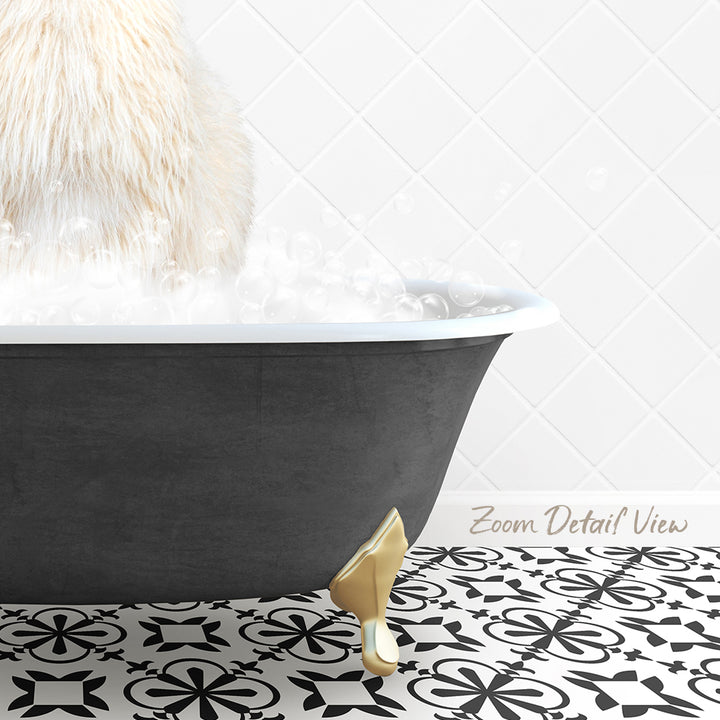 A fluffy white cat sitting in a black bathtub filled with bubbles, with a gold bathtub faucet and a patterned tile floor.