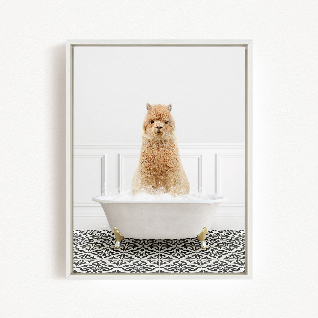 A fluffy brown alpaca sitting in a white bathtub filled with bubbles, surrounded by a black and white patterned floor.