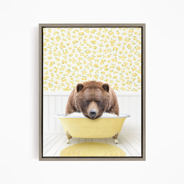A brown bear is sitting in a yellow bathtub, surrounded by a yellow floral pattern on the wall behind it.