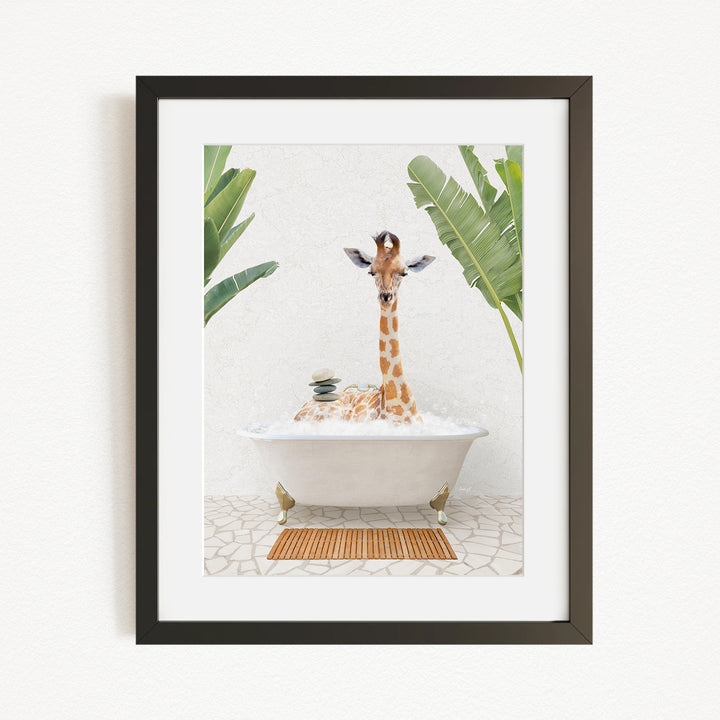 A giraffe sitting in a bathtub filled with water, surrounded by green plants.