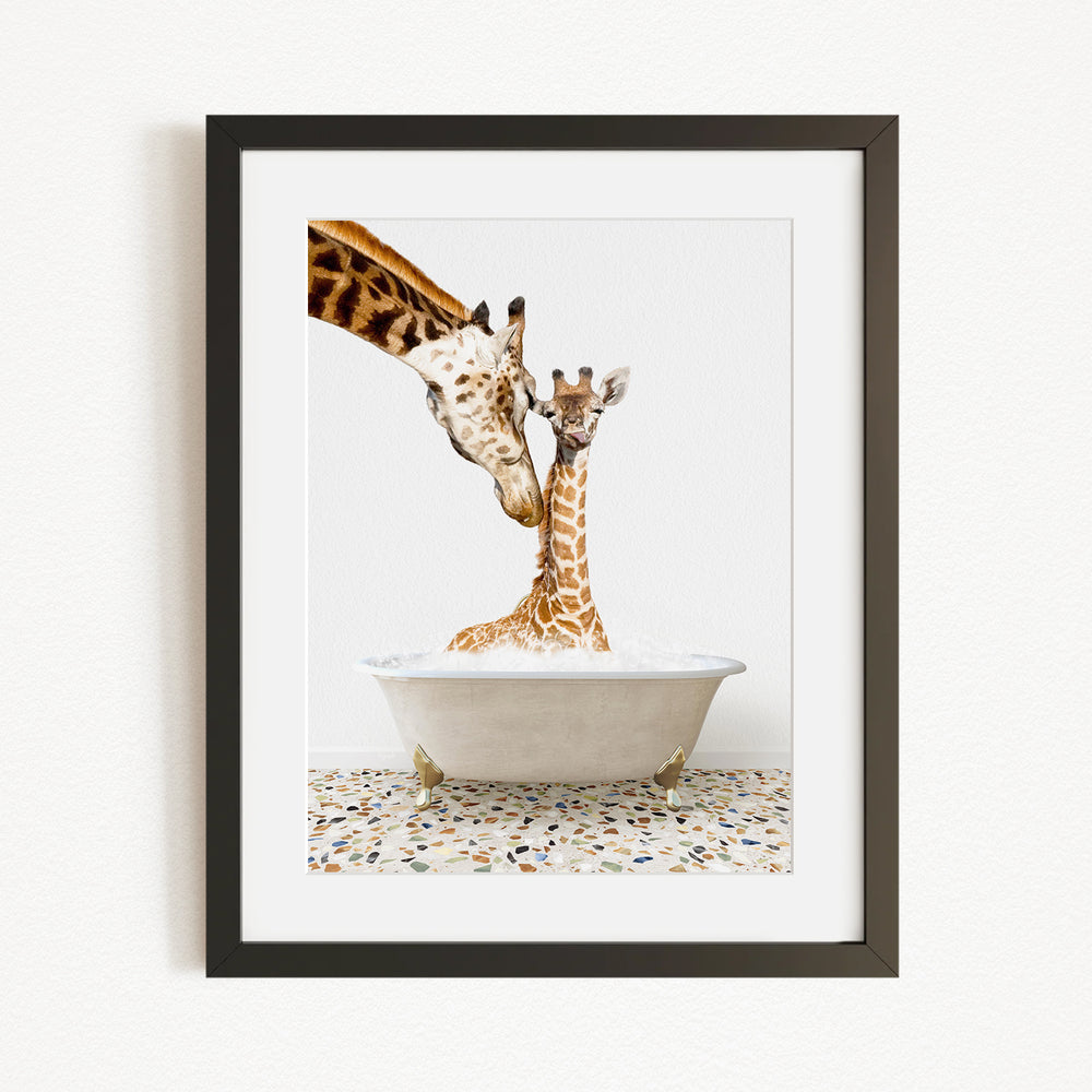 A mother giraffe and her baby giraffe are sitting together in a white bathtub filled with water, with the mother giraffe's head gently resting on the baby giraffe's back.