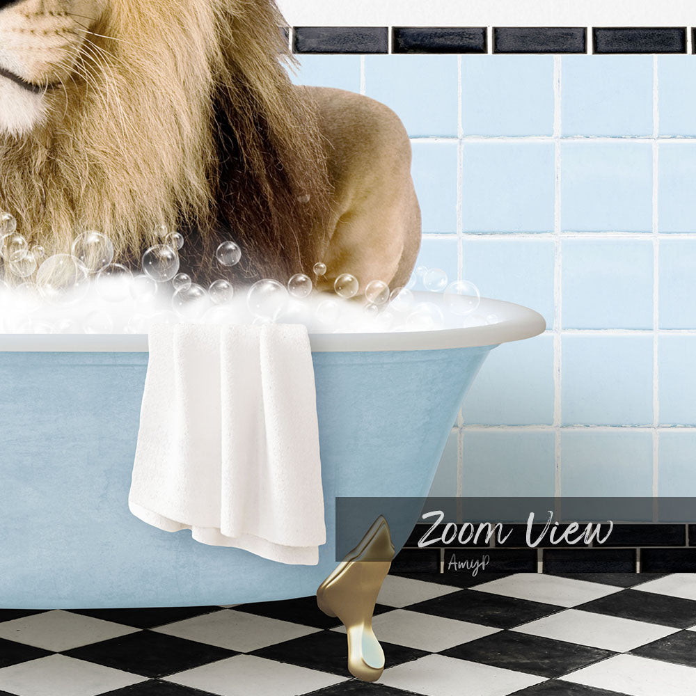 A lion is sitting in a blue bathtub filled with bubbles, with a towel and gold shoe visible in the foreground.