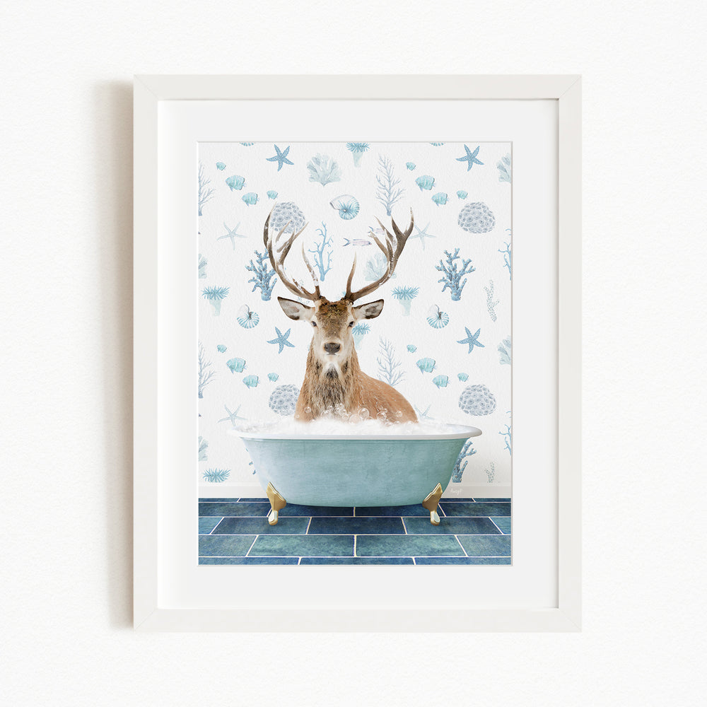 A deer with antlers is sitting in a bathtub filled with bubbles, surrounded by a blue and white patterned background.