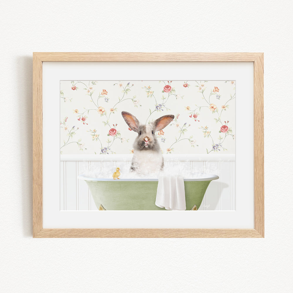 A fluffy white rabbit sits in a green bathtub filled with water, surrounded by a floral wallpaper.