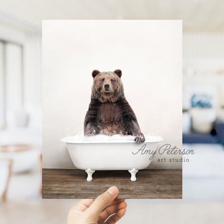 a bear sitting in a bathtub in a room