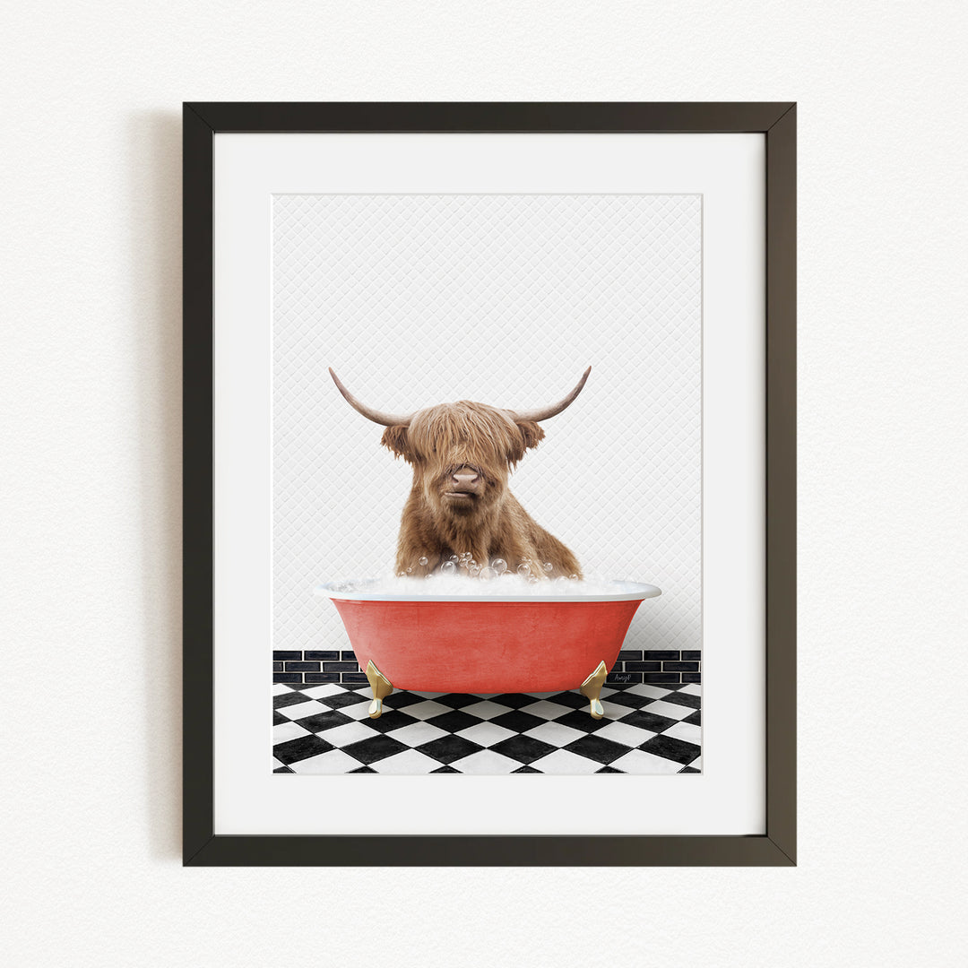 A Highland cow with long horns is sitting in a red bathtub, surrounded by a black and white checkered floor.