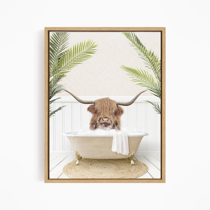 A brown cow with long horns is sitting in a bathtub filled with water, surrounded by green palm leaves.