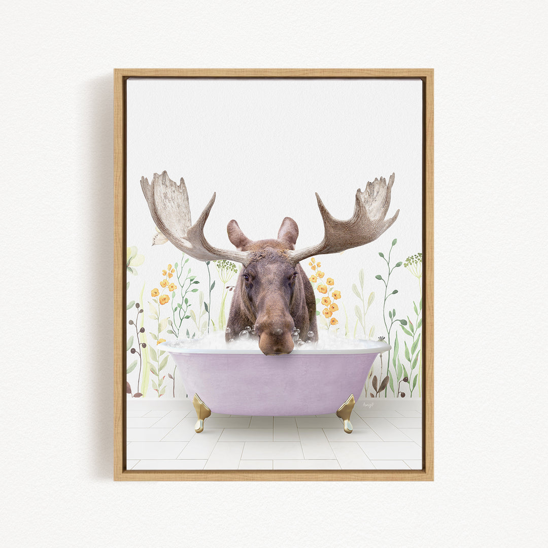 A moose with large antlers is sitting in a pink bathtub, surrounded by flowers and plants.