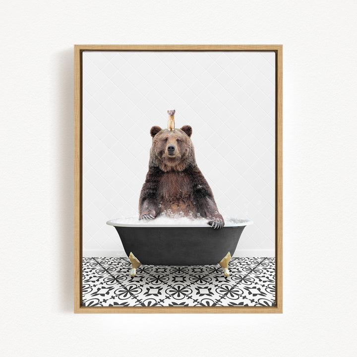 A brown bear sitting in a bathtub filled with water, with a small bird perched on its head.