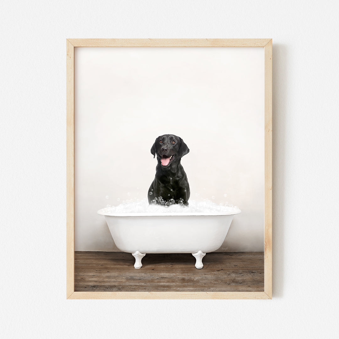 a black dog is sitting in a bathtub