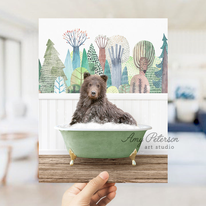 a person holding a card with a picture of a bear in a bathtub