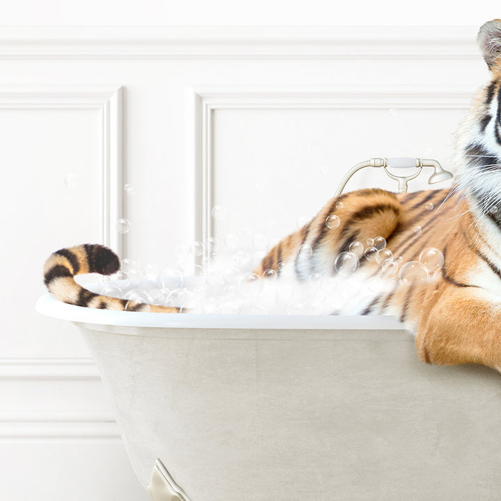 a stuffed tiger is sitting in a bathtub