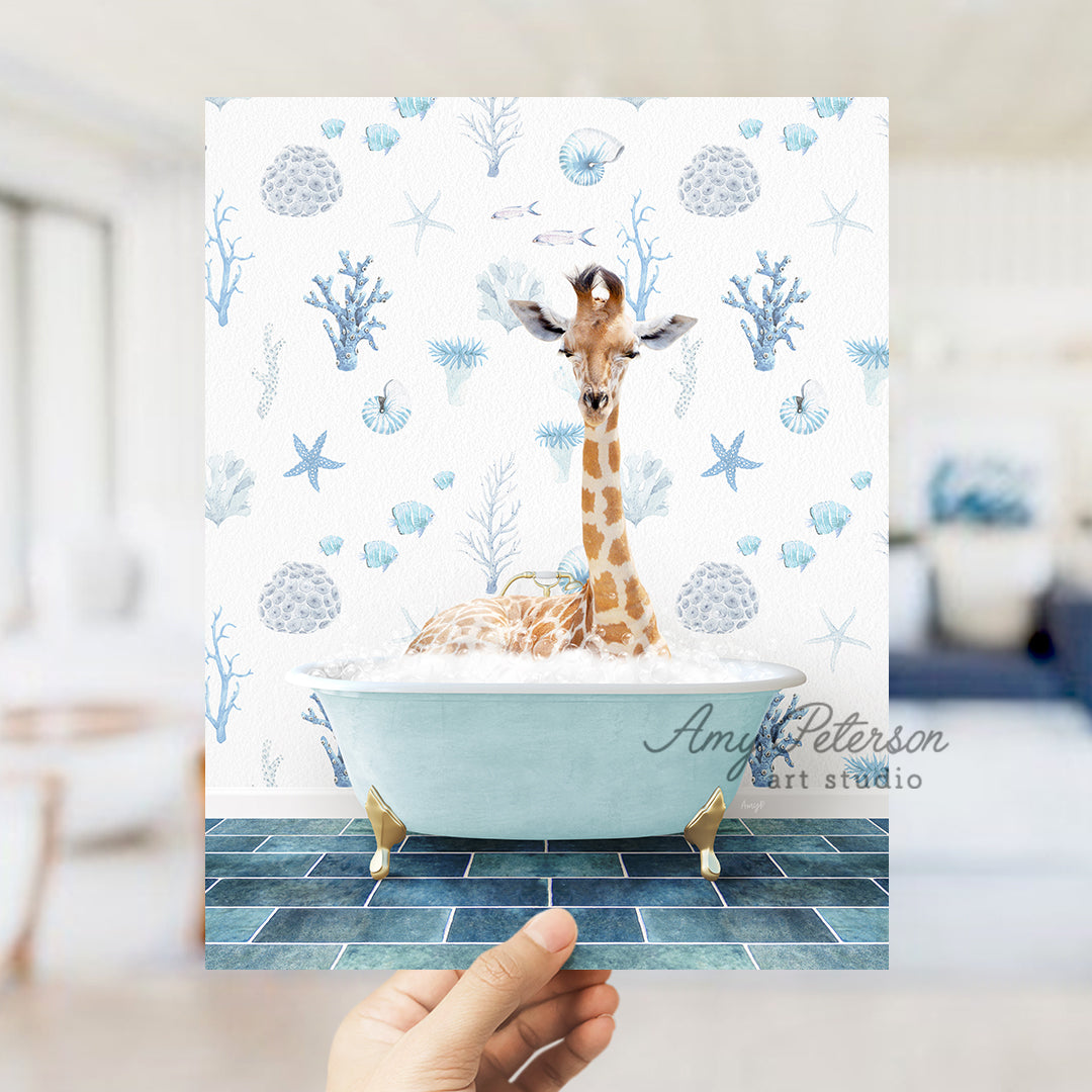 a hand holding up a card with a giraffe in a bathtub