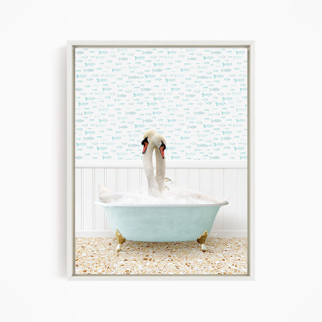 A white swan is sitting in a light blue bathtub filled with bubbles, with a patterned wall behind it.