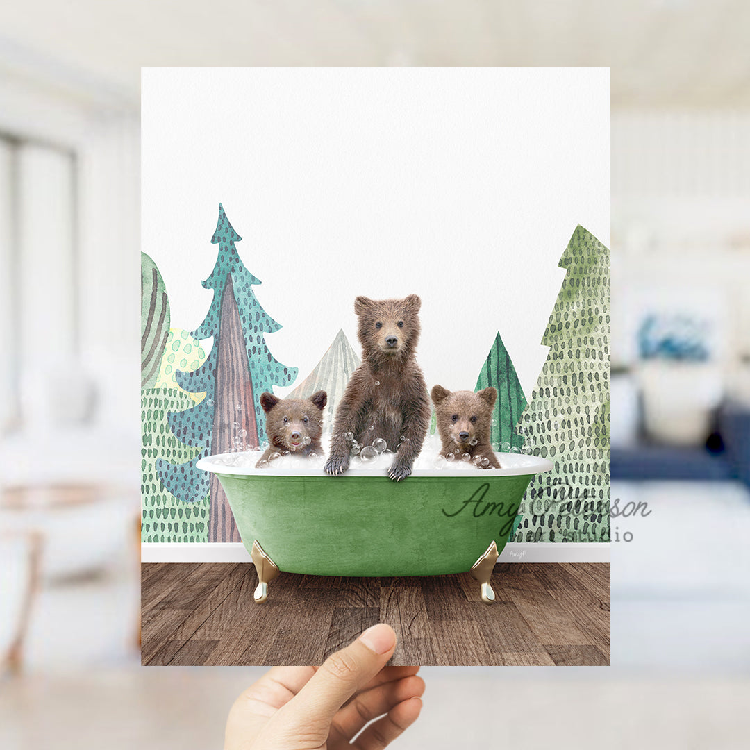 a person holding up a card with three bears in a bathtub