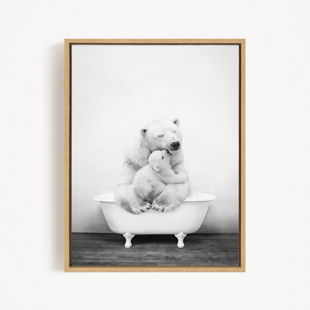 A black and white photograph of a mother polar bear sitting in a bathtub, with her cub nestled close to her.