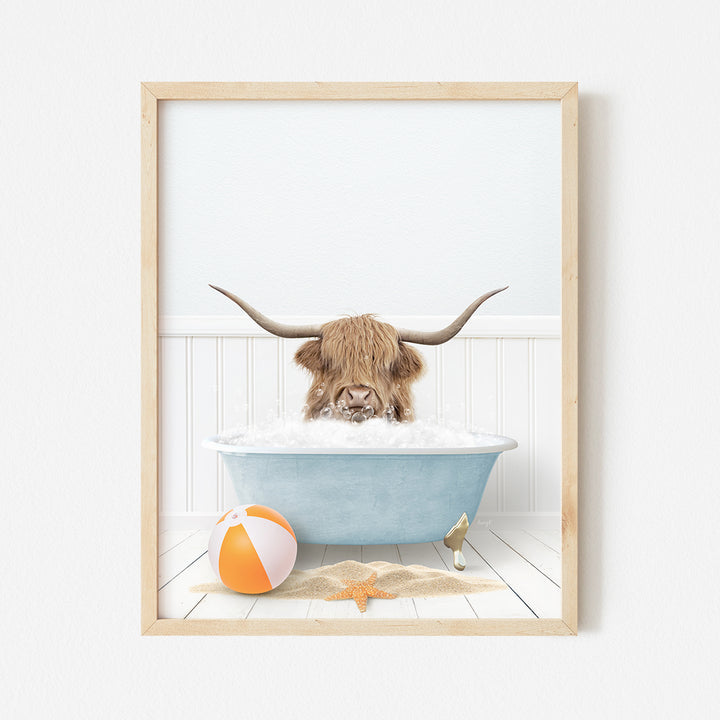 a picture of a bull in a bathtub with a beach ball