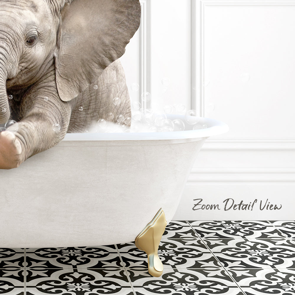 A baby elephant sitting in a white bathtub filled with water, surrounded by a black and white patterned floor.