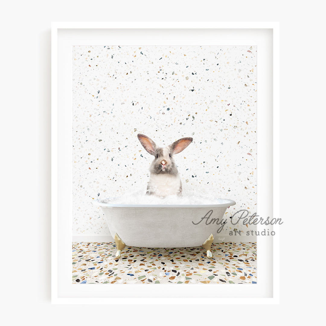 a rabbit sitting in a bathtub with a white background