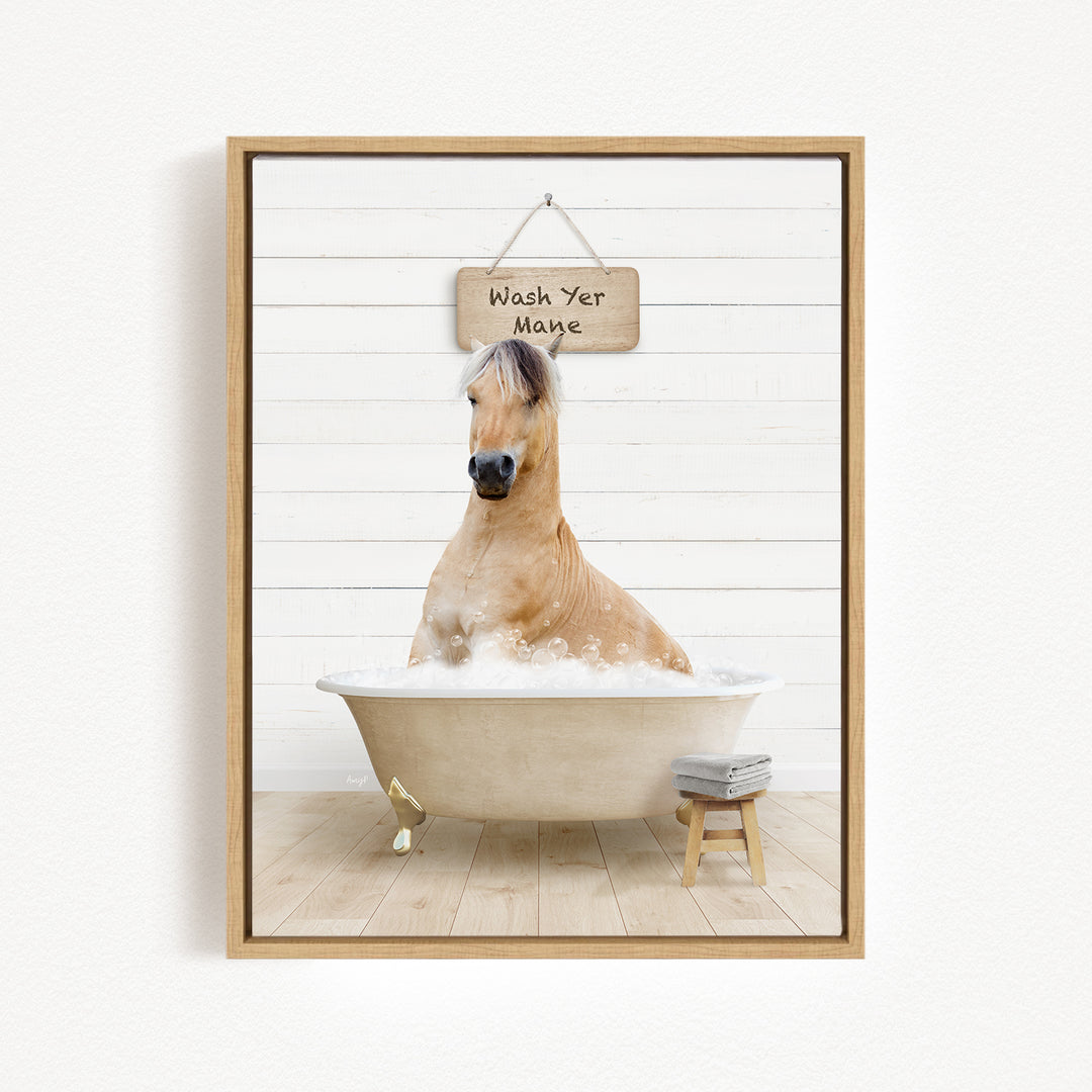 A light brown horse is sitting in a bathtub filled with water, with a sign above it that says "Wash Yer Mange".