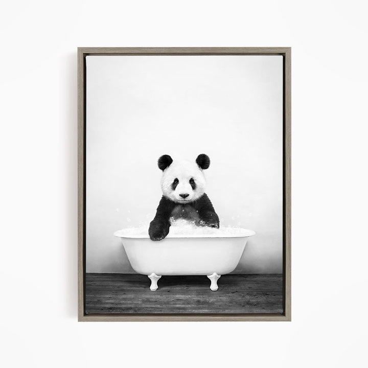 A panda bear sitting in a bathtub filled with water, creating a whimsical and playful scene.