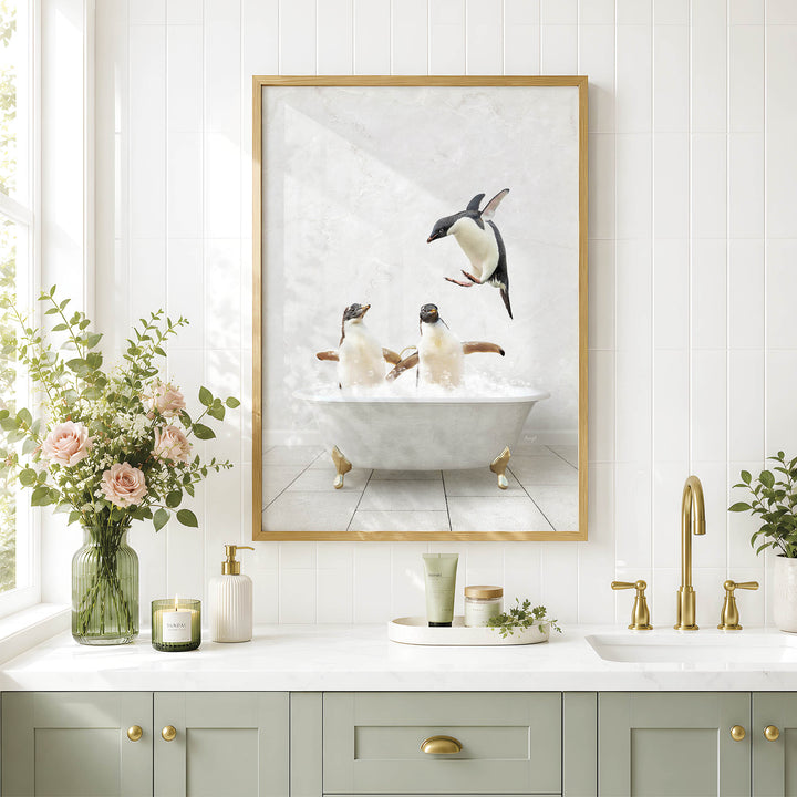 a bathroom scene with a framed picture of penguins sitting in a bathtub, surrounded by flowers and greenery.