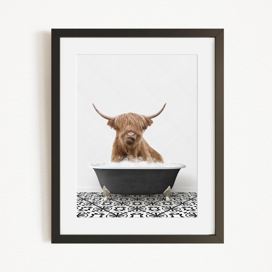 A Highland cow with long horns is sitting in a bathtub filled with water, creating a whimsical and amusing scene.
