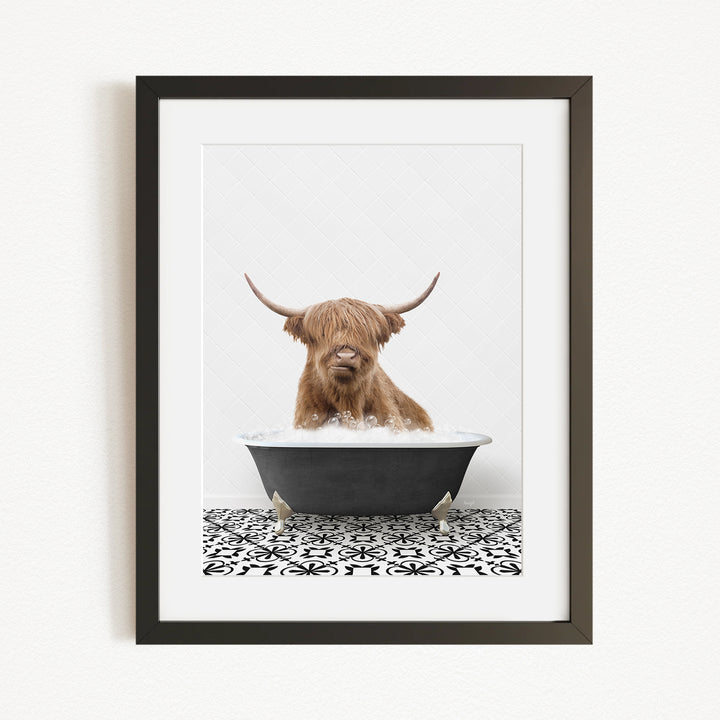 A Highland cow with long horns is sitting in a bathtub filled with water, creating a whimsical and amusing scene.