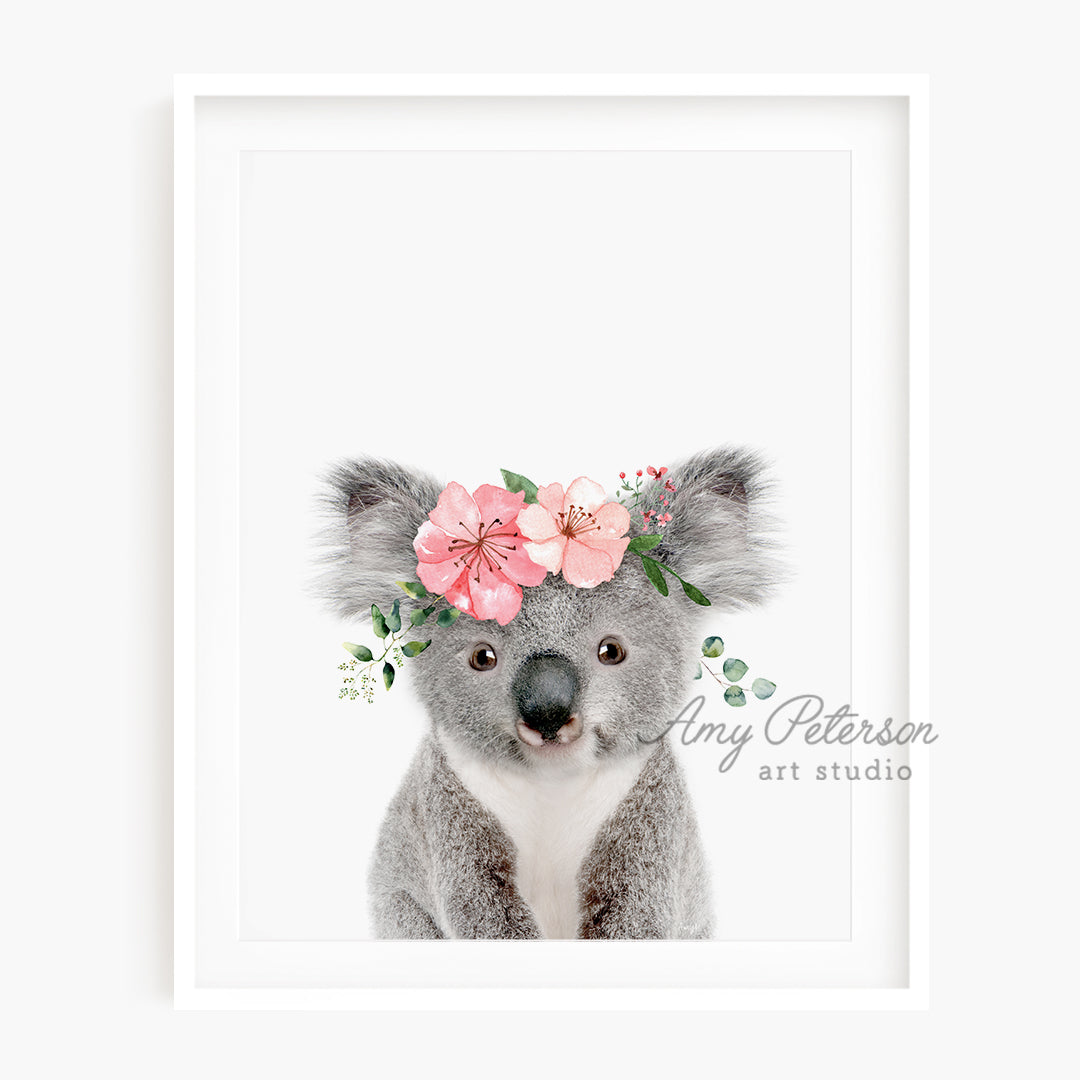 a picture of a koala with flowers on its head