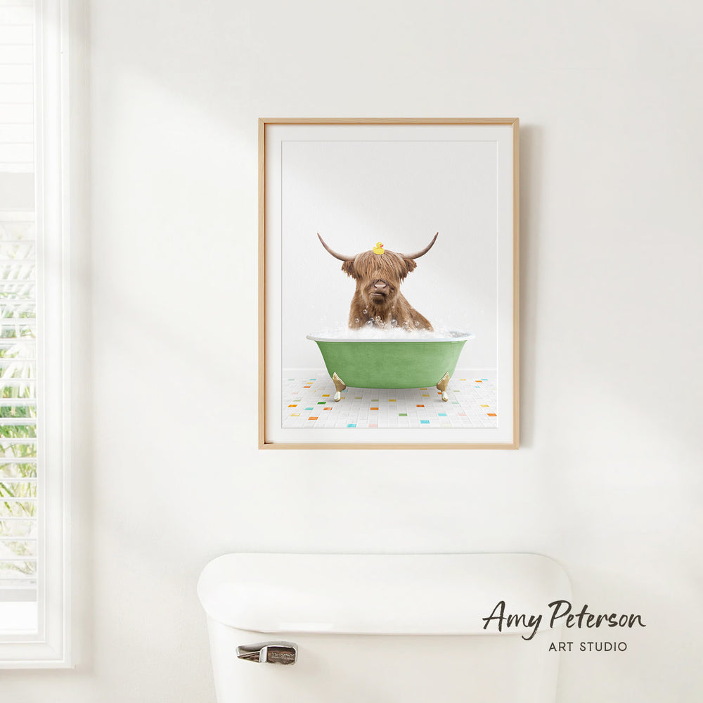 A framed image of a Highland cow sitting in a green bathtub, with a yellow rubber duck floating on the water.