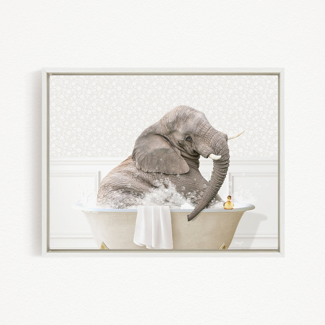 A gray elephant is sitting in a bathtub filled with water, with a yellow rubber duck floating nearby.