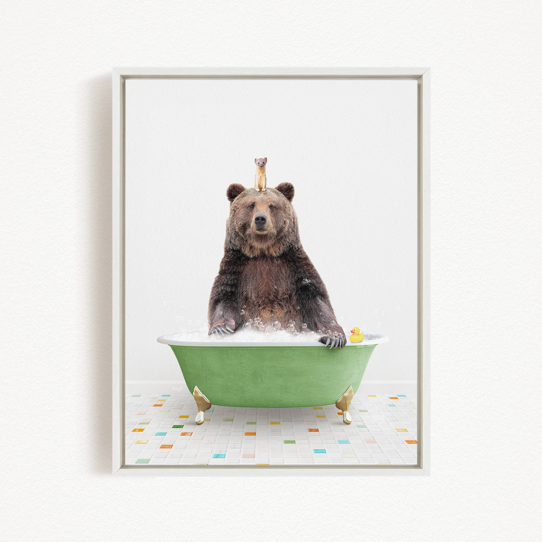 A large brown bear sitting in a green bathtub filled with bubbles, with a small bird perched on its head.