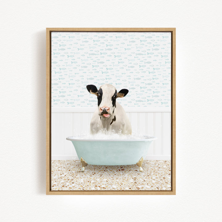 A cow is sitting in a bathtub filled with water, surrounded by a patterned wall and a tiled floor.
