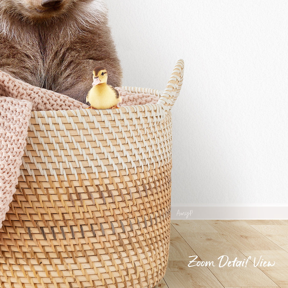 A small yellow duck sits in a woven basket, with a brown bear sitting next to it.