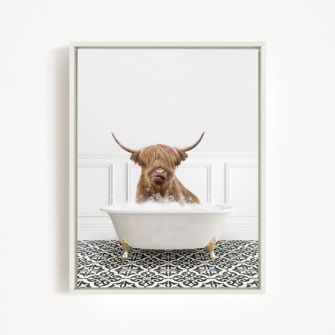A brown cow with long horns is sitting in a white bathtub filled with bubbles, creating a whimsical and playful scene.