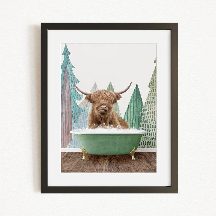 A Highland cow is sitting in a green bathtub, surrounded by trees and mountains in the background.