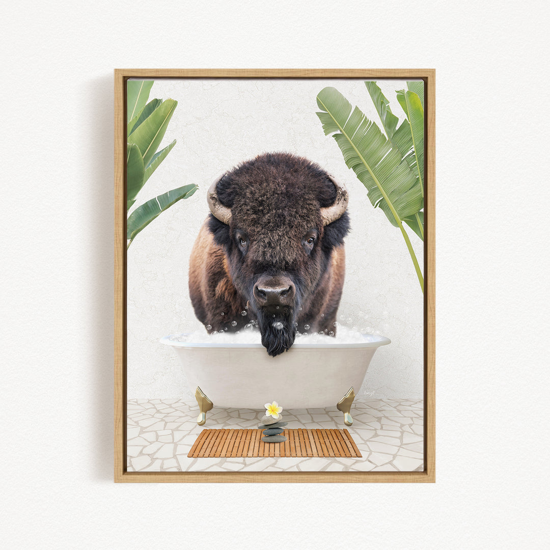 A buffalo is sitting in a bathtub filled with water, surrounded by tropical plants and a wooden mat on the floor.