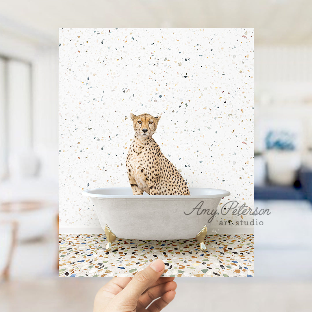 a hand holding a card with a picture of a cheetah in a bath