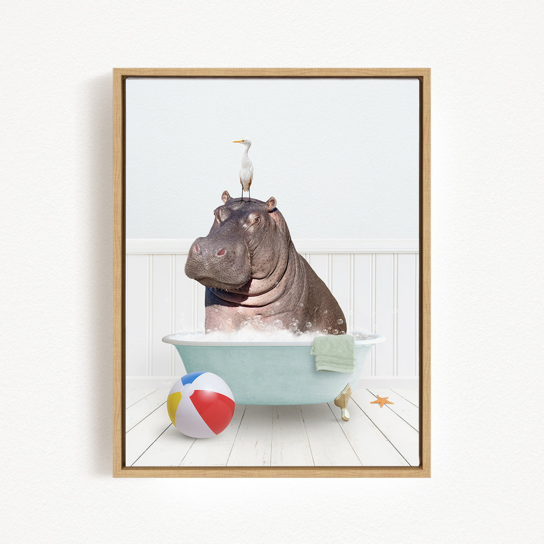 A hippopotamus sitting in a bathtub, with a bird perched on its head, and a beach ball nearby.