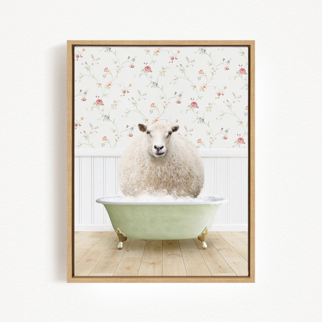 A fluffy white sheep sits in a green bathtub, surrounded by a floral wallpaper.