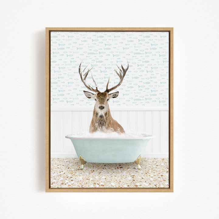 A deer with antlers is sitting in a bathtub filled with water, surrounded by a patterned wall.