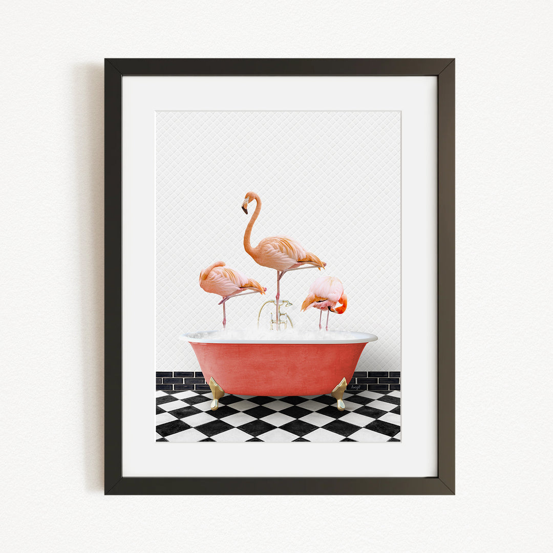A framed image depicting three flamingos standing in a red bathtub on a black and white checkered floor.