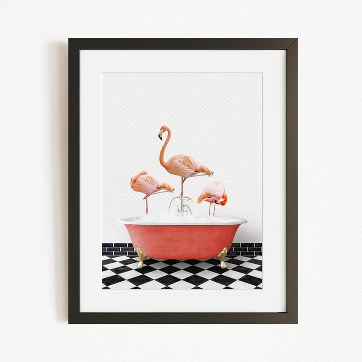 A framed image depicting three flamingos standing in a red bathtub on a black and white checkered floor.