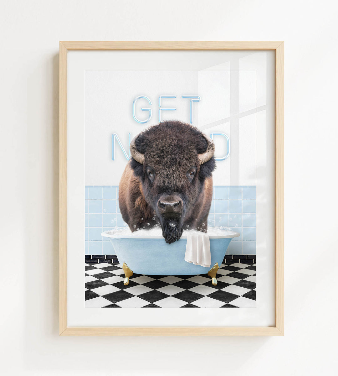 A buffalo is sitting in a bathtub filled with water, with the words "GET NICKED" written on the wall behind it.